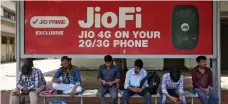  ?? Reuters ?? A Jio advertisem­ent at a bus stop in Mumbai. Qualcomm’s investment values Jio Platform’s equity at about $65.3bn