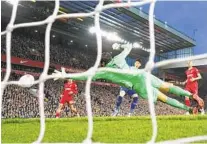  ?? JON SUPER AP ?? Liverpool’s goalkeeper Alisson fails to save the ball as Tottenham’s Son Heung-min scores his side’s only goal in EPL play.