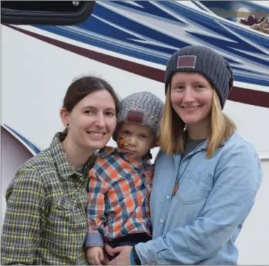  ?? MARIAN DENNIS — DIGITAL FIRST MEDIA ?? Jackson Radcliffe, center, pictured with parents Kayla Radcliffe and Melissa Mest, was the beneficiar­y for this year’s Red Corner Benefit. Jackson, 2, was diagnosed with Acute Myeloid Leukemia in February of this year.