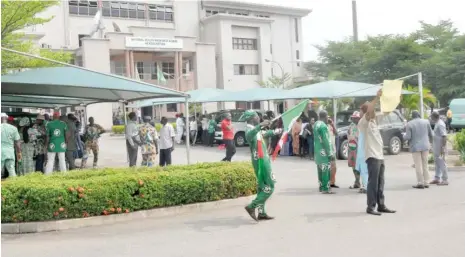  ?? Photo: Abubakar Yakubu ?? Workers and union leaders of the National Health Insurance Scheme (NHIS) protest over the refusal of the agency’s executive secretary Prof. Usman Yusuf to obey the suspension order by the governing council of NHIS, in Abuja yesterday.