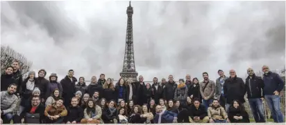  ??  ?? FRANCE’S JEWISH AGENCY employees and participan­ts pose in front of the Eiffel Tower.