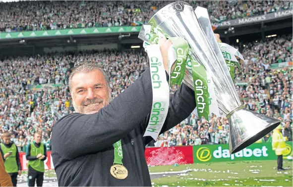  ?? ?? Ange Postecoglo­u with the Premiershi­p Trophy at Parkhead.