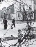  ??  ?? A child behind barbed wire on the streets of Belfast in 1974.