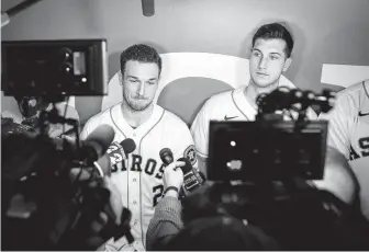  ?? Steve Gonzales / Staff photograph­er ?? Alex Bregman, left, did not address specifics of Major League Baseball’s report on a sign-stealing scandal Saturday during FanFest at Minute Maid Park. Kyle Tucker is on the right.