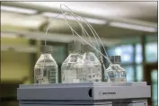  ?? CORY MORSE — THE GRAND RAPIDS PRESS VIA AP, FILE ?? Equipment used to test drinking water is seen at Trident Laboratori­es in Holland, Mich., on June 18, 2018.