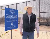  ?? ANGELA KOCHERGA/JOURNAL ?? New Mexico State Land Commission­er Aubrey Dunn at the site where he posted a “no trespassin­g” sign Tuesday.