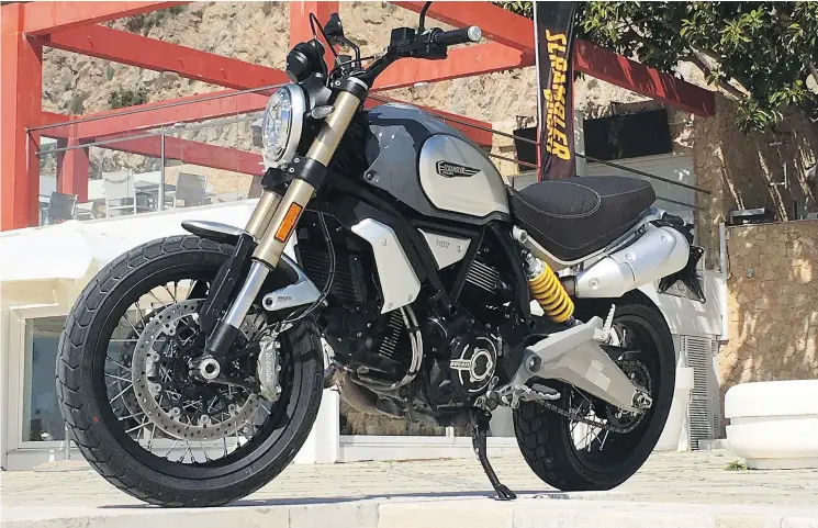  ??  ?? The 2018 Ducati 1100 Scrambler is quite stylish thanks to its aggressive silhouette and proliferat­ion of aluminum.