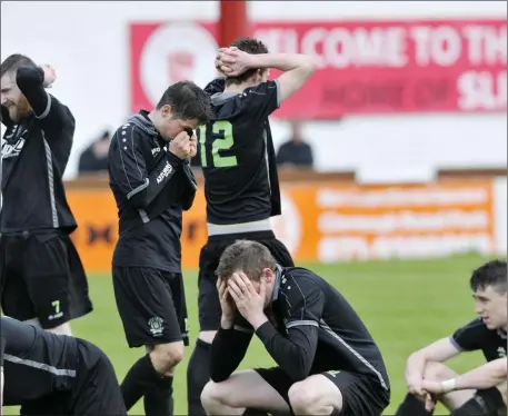  ??  ?? Boyle Celtic players show their devastatio­n after the penalty shoot- out in the Showground­s. Pic: Carl Brennan.