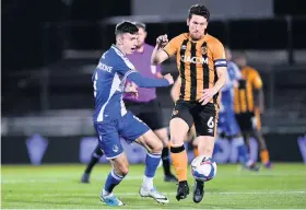  ??  ?? Rovers‘ Zain Westbrooke comes under pressure from Richie Smallwood