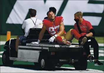  ?? BILL KOSTROUN — THE ASSOCIATED PRESS, FILE ?? San Francisco 49ers defensive end Nick Bosa (97) is carted off the field after being injured during the first half against the Jets on Sept. 20 in East Rutherford, N.J.