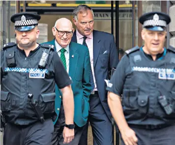  ??  ?? John Leslie leaves Edinburgh Sheriff Court with his father, Les Stott, after being cleared of sexual assault