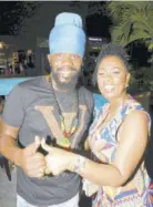  ?? ?? Natty Sean, one of the artistes on the rhythm, poses with public relations representa­tive Kim Ambrose for Heart Ah Love Records.