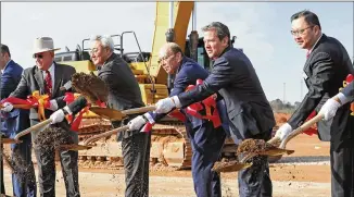  ?? BOB ANDRES/BOB.ANDRES@AJC.COM ?? SK Innovation CEO Kim Jun (from left), then-u.s. Secretary of Commerce Wilbur Ross, Gov. Brian Kemp and SK Executive Vice Chairman Chey Jae join in a groundbrea­king ceremony in March 2019 for the $1.7 billion battery plant in Jackson County. The project is expected to produce 2,600 jobs but was put in danger by a ruling by the U.S. Internatio­nal Trade Commission.