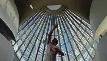  ?? ?? A competitor throws his paper plane during the national Red Bull Paper Wings paper airplane throwing championsh­ips at the Museum of Tomorrow in Rio de Janeiro, Brazil. — AFP photos