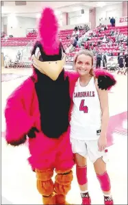  ?? MARK HUMPHREYEN­TERPRISE-LEADER ?? Farmington 2019 graduate Madisyn Pense poses with the Cardinal mascot. Pense scored 12 points in the Lady Cardinals’ 71-64 win over Pea Ridge to reach 1,000 career points on Tuesday, Dec. 18, 2018, at Cardinal Arena. Pense has been named Female Athlete of the Year for school year 2018-2019 at Farmington by Enterprise-Leader.