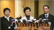  ?? PARKER ZHENG / CHINA DAILY ?? Chief Executive Carrie Lam Cheng Yuet-ngor introduces newly appointed Secretary for Justice Teresa Cheng Yeuk-wah (left) to the media at the Central Government Complex on Friday. Rimsky Yuen Kwok-keung (right) has resigned from the post of secretary...