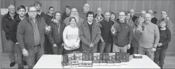  ?? LAWRENCE POWELL ?? Members of Annapolis County Ground Search and Rescue gathered around a table with their new Garmin Gpsmap 64s units and map software. They took a break during a meeting at the Legion in Bridgetown Jan. 7 to check out the new high-tech gear.