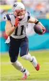  ?? ALAN DIAZ/ASSOCIATED PRESS ?? Patriots wide receiver Julian Edelman runs against the Dolphins. New England went unbeaten on the road.