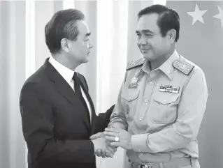  ??  ?? THAI VISIT Chinese Foreign Minister Wang Yi (L) shakes hands with Thai Prime Minister Prayuth Chan- O- Cha (R) at Government House in Bangkok on July 24, 2017. PARIS: