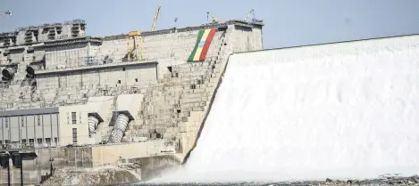  ?? ?? The Ethiopian national flag is seen at the Grand Ethiopian Renaissanc­e Dam (GERD) in Guba, Ethiopia, Feb. 19, 2022.