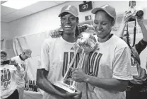  ?? BRETT DAVIS / USA TODAY SPORTS ?? Lynx forward Devereaux Peters, left, and forward Maya Moore celebrate after winning the WNBA title in 2013.