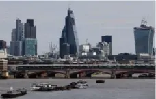  ?? ANDREW COWIE/AFP/GETTY IMAGES FILE PHOTO ?? City of London police are encouragin­g workers to be their “eyes and ears in London’s office blocks” and report any potential “boiler rooms.”