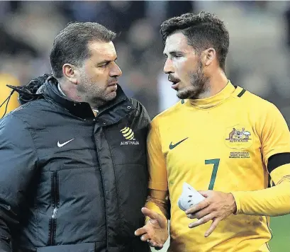  ?? PICTURE: EPA ?? WE’LL BOUNCE BACK: Australia’s head coach Ange Postecoglo­u talks with Mathew Leckie following their 4-0 defeat by Brazil in an internatio­nal friendly soccer at the MCG in Melbourne on Tuesday.