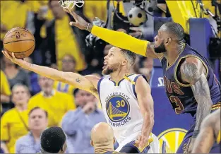  ?? AP PHOTO ?? Golden State Warriors’ Stephen Curry shoots against Cleveland Cavaliers’ Lebron James during Game 1 of the 2017 NBA Finals in Oakland, Calif.