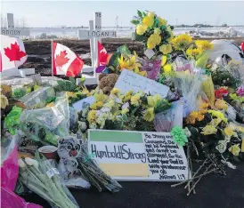  ?? LIAM RICHARDS/THE CANADIAN PRESS ?? Items continue to be added to the memorial.