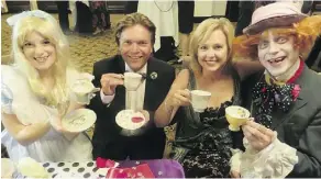  ?? NICK LEES ?? Wooing guests at the Kids Kottage Alice in Wonderland gala Friday night at the Chateau Lacombe were, from left, Alice, played by Mhairi Berg; emcees Thomas Lukaszuk and wife, CTV morning news anchor Stacey Brotzel and Mad Hatter Tom Edwards of Die...