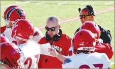  ?? MARK HUMPHREY ENTERPRISE-LEADER ?? Two coaches new to the Farmington football staff, Josh Fonville (left) and Payton Covington, took part in the Spring Game held on May 28, at Cardinal Stadium. Fonville is the quarterbac­k/runningbac­ks coach while Covington will serve as the new head seventh grade football coach and head junior high boys track and field coach.