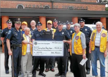  ?? SUBMITTED PHOTO ?? The Springfiel­d Lions Club donated money to purchase nine bulletproo­f vests for the Springfiel­d Police Department. Pictured in front are: Chief Joe Daly, Lion Ed Rocco, Officer Rick Christy, Officer Steve Hurwitz, Lion President Kathleen Lawless; in...
