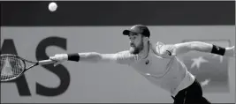  ?? ASSOCIATED PRESS ?? STEVE JOHNSON PLAYS A SHOT against Croatia’s Borna Coric during their second round match of the French Open at the Roland Garros stadium in Paris on Wednesday.