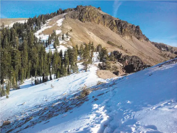  ?? Tom Stienstra / The Chronicle ?? The view of 9,103-foot Castle Peak from Castle Pass, located across Interstate 80 from Boreal Ski Area near Donner Summit. In low snow conditions, you can climb Castle Peak in winter with Yaktrax and ski poles.