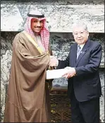  ?? KUNA photos ?? Kuwait’s Speaker Marzouq Ali Al-Ghanim hands over document to Japanese Parliament­ary official.