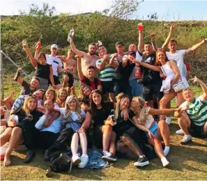  ??  ?? COVIDIOTS: Students pile in for a photo at an illegal party in Lanarkshir­e