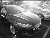  ?? PATRICK T. FALLON/BLOOMBERG ?? Ford Fusion, shown, Taurus, Fiesta and C-Max van will be phased out, according to Ford’s earnings statement.