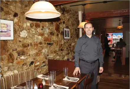  ?? SUBMITTED PHOTO ?? Ahmed Charga, owner of Byrsa Bistro with locations in Kennett Square and Glen Mills, inside his restaurant.