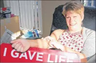  ?? JIM DAY/THE GUARDIAN ?? Betty Lutz of Charlottet­own donates blood Wednesday at the blood collection centre in Charlottet­own. Canadian Blood Services has an urgent need for blood donation this holiday season.