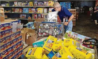  ??  ?? Puerto Rico’s food bank, which has been in operation 28 years, saw an outpouring of volunteers after Hurricane Maria.