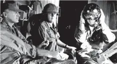  ?? COURTESY PHOTO ?? War correspond­ent Joe Galloway, pictured at center aboard a Marine helicopter in Vietnam in January 1966, will deliver a keynote address during the Albuquerqu­e celebratio­n of Ernie Pyle.