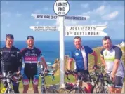  ??  ?? FINISH: The cyclists at Land’s End after a gruelling 918 miles