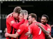  ?? Pictures: John Leakey ?? The Robins celebrate after taking a two goal lead