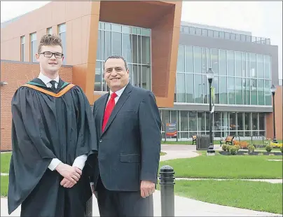  ?? SUBMITTED PHOTO ?? Andrew Simmons, a member of UPEI’s first graduating class in the bachelor of science in sustainabl­e design engineerin­g program, is shown with UPEI president Alaa Abd-El-Aziz outside the engineerin­g school.