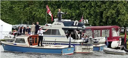  ??  ?? Troubled waters? Officers pull up next to a crowded boat on the Thames at Henley yesterday