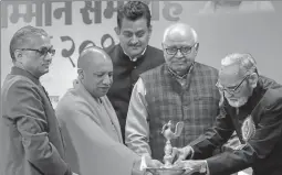  ?? SUBHANKAR CHAKRABORT­Y/HT PHOTO ?? ▪ Chief minister lighting the lamp at the award function of the Hindi Sansthan on Monday.