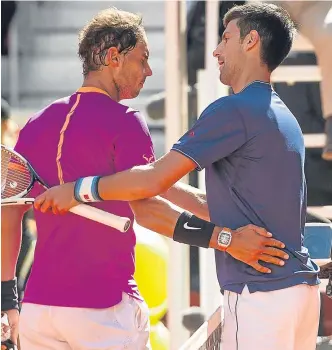  ??  ?? ■
Novak Djokovic congratula­tes Rafael Nadal on his victory.