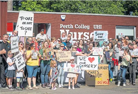  ?? ?? PROTEST: Families turned out in numbers to fight the move to axe the nursery. Picture by Mhairi Edwards.