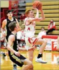  ?? PILOT PHOTO/RON HARAMIA ?? Nolan Bales gets this floater off in the key during Plymouth’s final home game Wednesday.