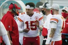 ?? WILFREDO LEE — THE ASSOCIATED PRESS ?? Patrick Mahomes (15) and Andy Reid have the AFC’s firstround bye as they look to defend their Super Bowl title.
